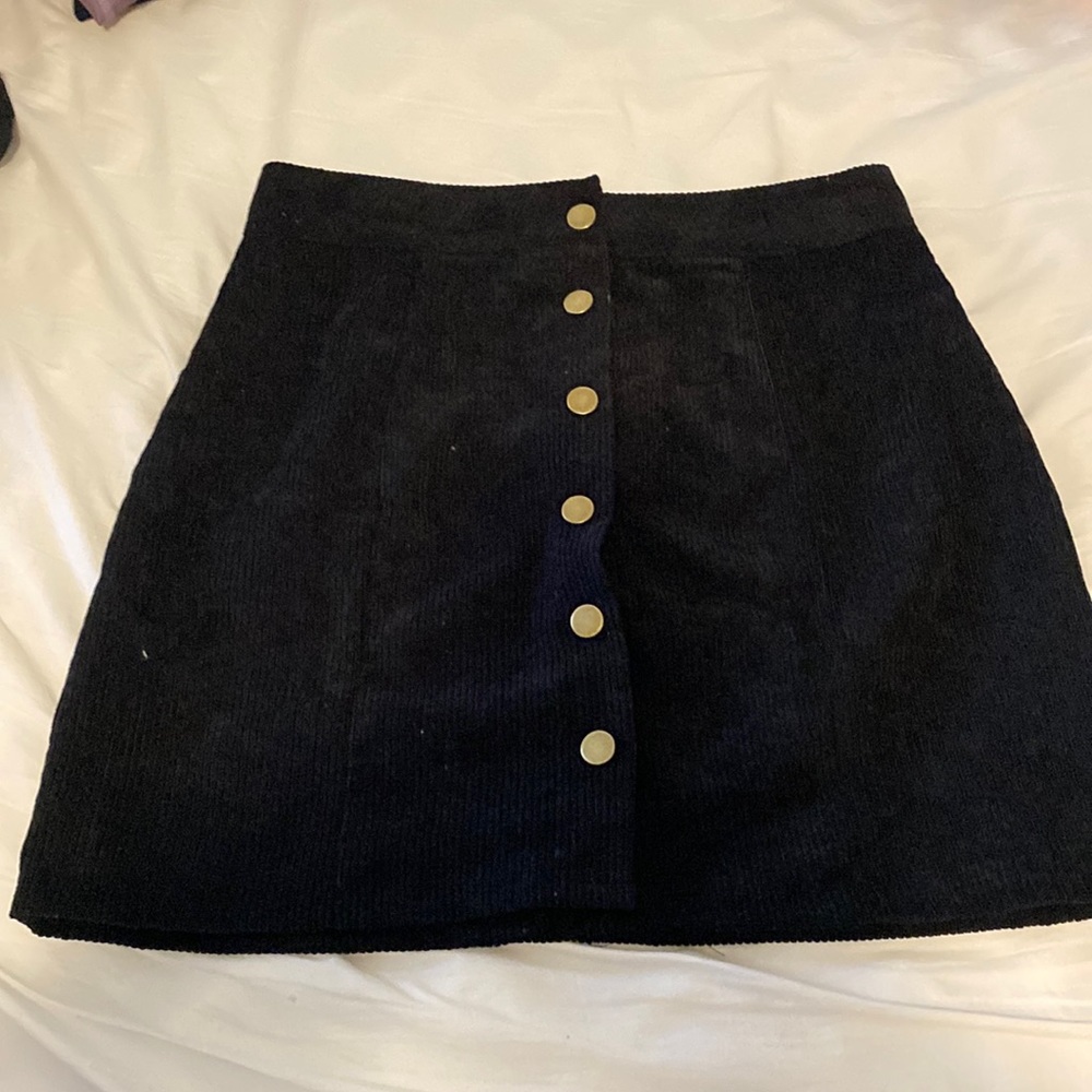 Black skirt with gold buttons